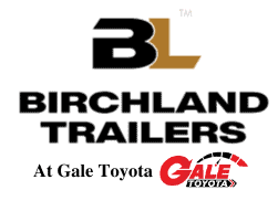 A lineup of utility trailers in various sizes and designs captured with a wide-angle lens. Birchland Trade Mark Logo